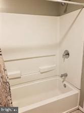 bathroom with shower / tub combo