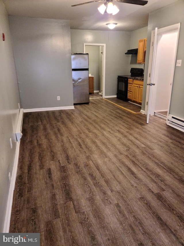 unfurnished living room with dark wood-type flooring, ceiling fan, and baseboards