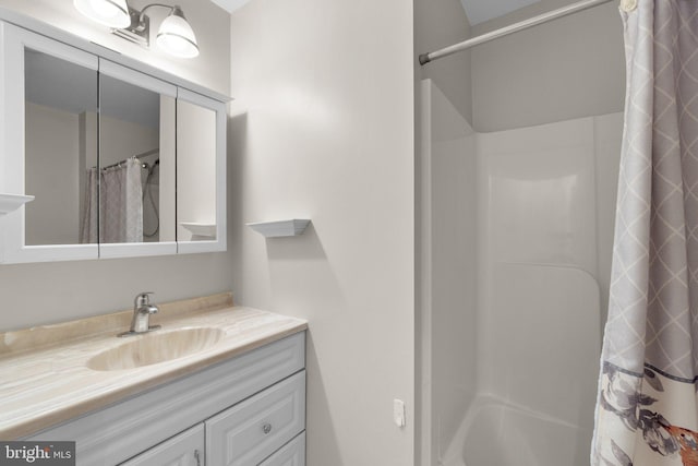 bathroom with vanity and a shower with curtain