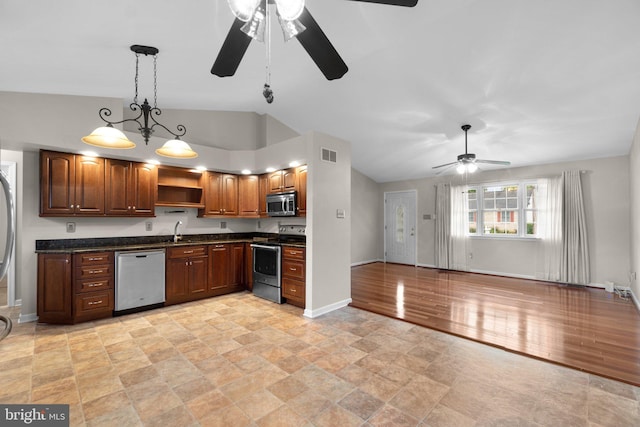 kitchen with stainless steel appliances, ceiling fan, open shelves, dark countertops, and lofted ceiling