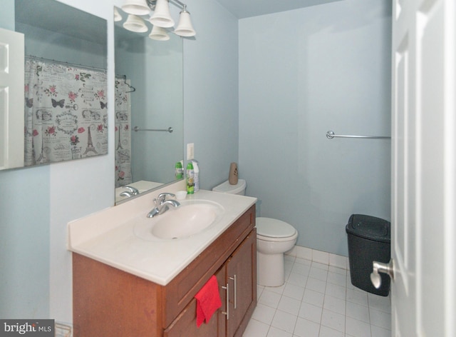 full bath with tile patterned floors, vanity, and toilet