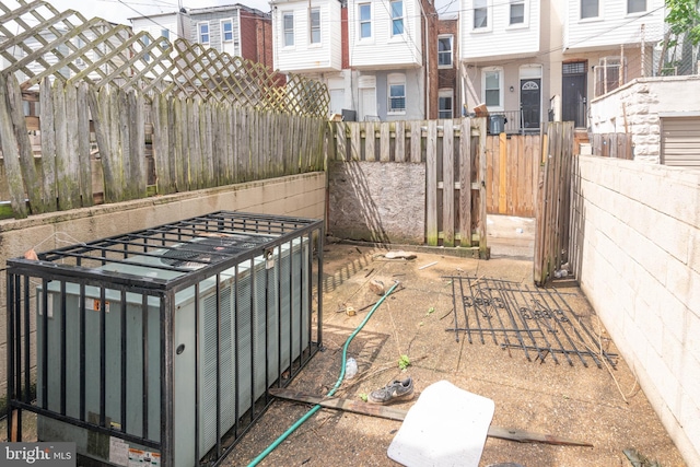 view of yard featuring fence and a residential view