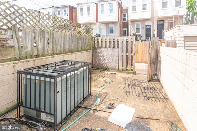 view of patio with fence and central AC