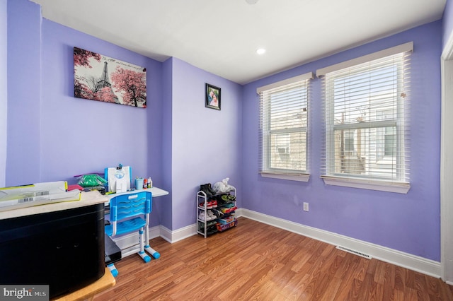 office area featuring light wood-style floors, baseboards, and recessed lighting