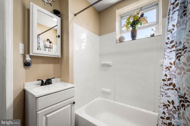 bathroom featuring vanity and shower / tub combo