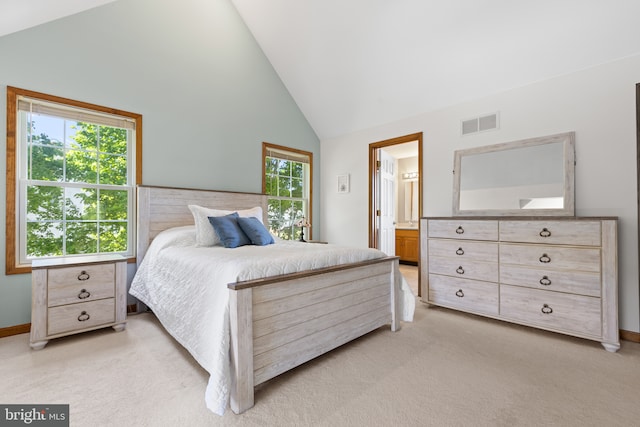 bedroom with light carpet, high vaulted ceiling, and baseboards