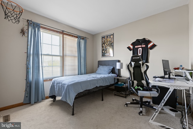 bedroom featuring carpet floors, a desk, and baseboards