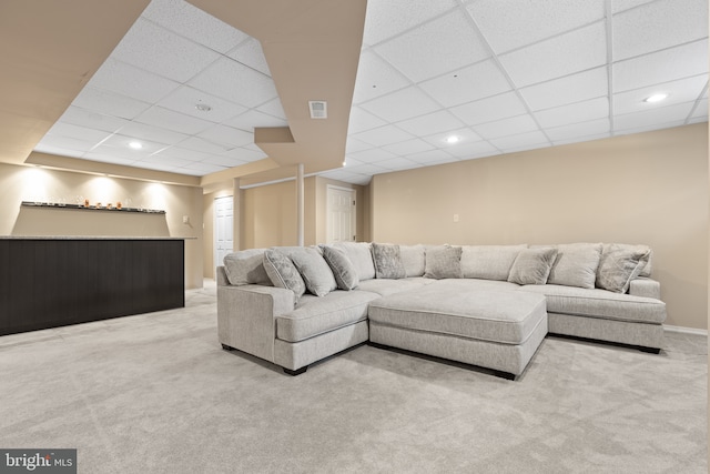 living room featuring a drop ceiling, carpet floors, bar, recessed lighting, and baseboards