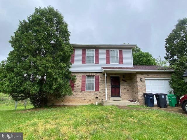 6704 Middlefield Rd, Fort Washington, MD 20744 - traditional home with a garage, a front yard, and brick siding
