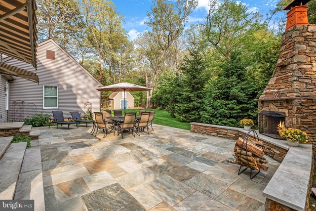 3 Mills Brook Ln, Shamong, NJ 08088 - view of patio / terrace featuring an outdoor stone fireplace and outdoor dining area