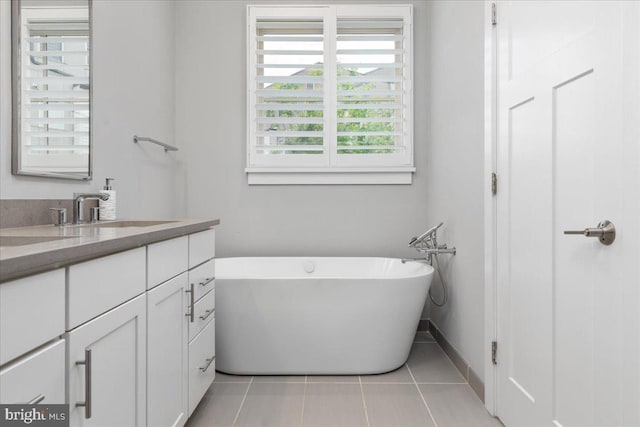 101 Dyer Ct, Herndon, VA 20170 - bathroom featuring vanity, tile patterned floors, and a soaking tub