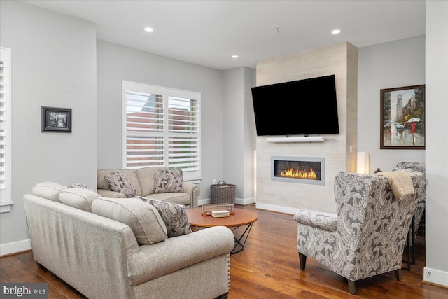 101 Dyer Ct, Herndon, VA 20170 - living room with a large fireplace, wood finished floors, recessed lighting, and baseboards