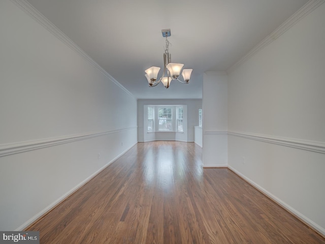 13195 Golders Green Pl, Bristow, VA 20136 - empty room featuring a chandelier, wood finished floors, baseboards, and crown molding