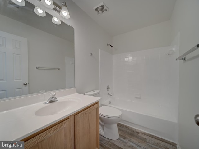 13195 Golders Green Pl, Bristow, VA 20136 - bathroom with wood finished floors, toilet, tub / shower combination, and vanity