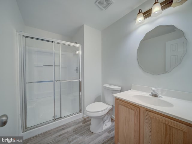 13195 Golders Green Pl, Bristow, VA 20136 - bathroom with wood finished floors, a shower stall, toilet, and vanity