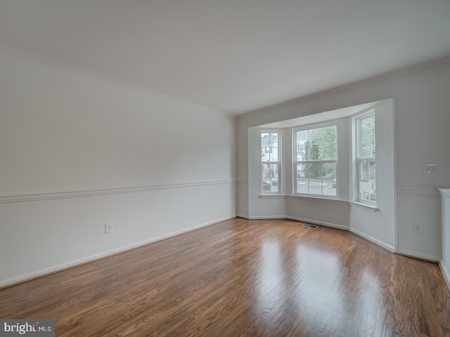 13195 Golders Green Pl, Bristow, VA 20136 - unfurnished room with crown molding, wood finished floors, and baseboards