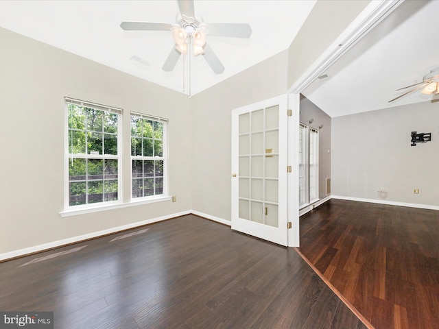 unfurnished room featuring ceiling fan, wood finished floors, and baseboards