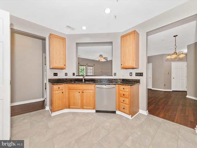 kitchen with dishwasher, a sink, a chandelier, light brown cabinets, and recessed lighting