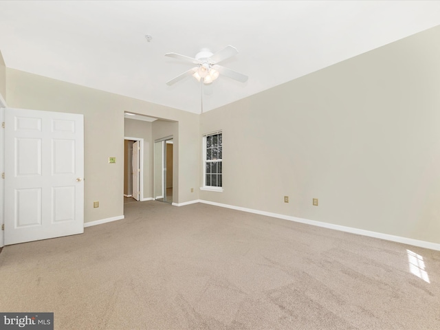 unfurnished bedroom featuring carpet floors, baseboards, and ceiling fan