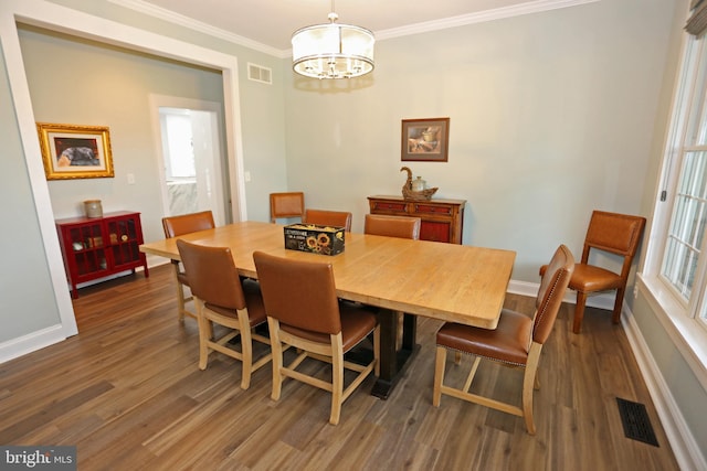 168 Williams Way, Lewes, DE 19958 - dining room with a chandelier, baseboards, dark wood-style floors, and ornamental molding