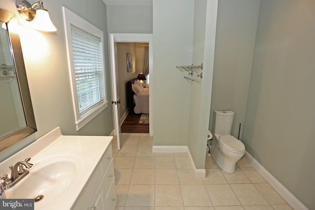 168 Williams Way, Lewes, DE 19958 - bathroom with toilet, tile patterned floors, vanity, baseboards, and ensuite bath