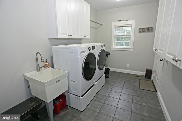 168 Williams Way, Lewes, DE 19958 - laundry area featuring washing machine and dryer, baseboards, cabinet space, and dark tile patterned floors