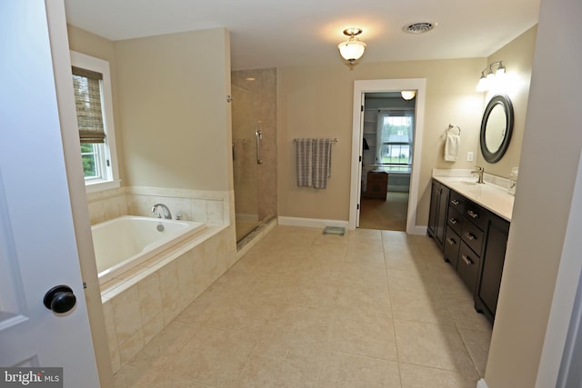 168 Williams Way, Lewes, DE 19958 - bathroom with tile patterned floors, a bath, a stall shower, and double vanity