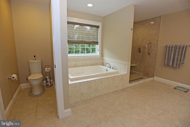 168 Williams Way, Lewes, DE 19958 - full bathroom featuring a shower stall, a garden tub, tile patterned flooring, toilet, and baseboards