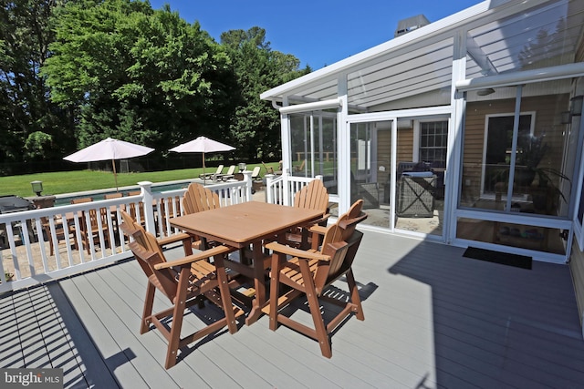 168 Williams Way, Lewes, DE 19958 - deck featuring outdoor dining area, a yard, and a sunroom