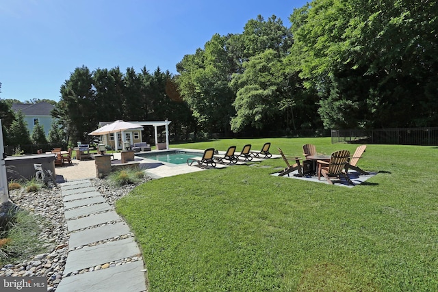 168 Williams Way, Lewes, DE 19958 - view of yard featuring a fire pit, a patio, an outdoor pool, a storage structure, and view of scattered trees