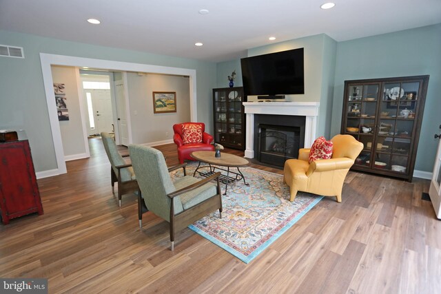 168 Williams Way, Lewes, DE 19958 - living area featuring wood finished floors, a fireplace with flush hearth, baseboards, and recessed lighting