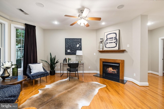 1615 Brandywine St, Philadelphia, PA 19130 - sitting room featuring wood finished floors, a glass covered fireplace, a ceiling fan, baseboards, and recessed lighting