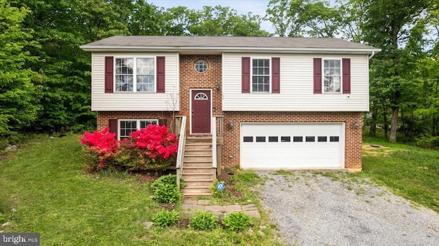 144 Falcon Trl, Winchester, VA 22602 - raised ranch with gravel driveway, brick siding, a front yard, and an attached garage