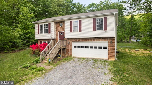 144 Falcon Trl, Winchester, VA 22602 - split foyer home featuring driveway, brick siding, a front yard, and an attached garage