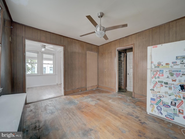 820 Tuckerman St NW, Washington, DC 20011 - unfurnished room with ceiling fan, wooden walls, and light wood-type flooring