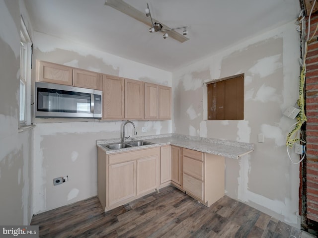 820 Tuckerman St NW, Washington, DC 20011 - kitchen featuring light brown cabinets, stainless steel microwave, dark wood finished floors, and light countertops