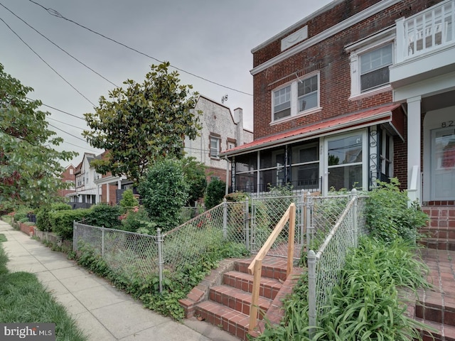 820 Tuckerman St NW, Washington, DC 20011 - view of front facade with brick siding and a gate
