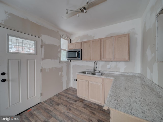 820 Tuckerman St NW, Washington, DC 20011 - kitchen featuring light brown cabinetry, stainless steel microwave, plenty of natural light, and dark wood finished floors