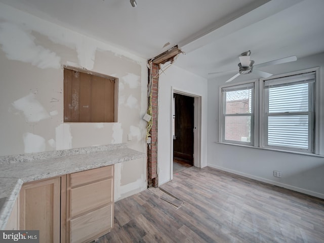 820 Tuckerman St NW, Washington, DC 20011 - kitchen featuring wood finished floors, light brown cabinetry, light countertops, and ceiling fan