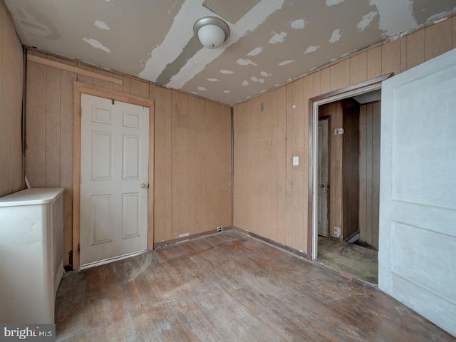 820 Tuckerman St NW, Washington, DC 20011 - unfurnished room featuring wood finished floors and wood walls