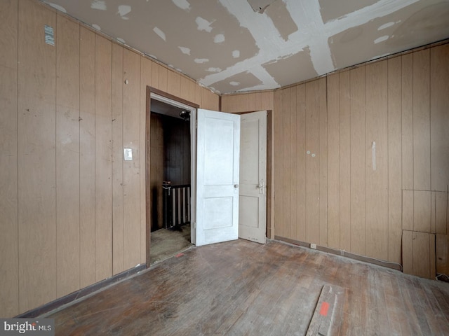 820 Tuckerman St NW, Washington, DC 20011 - spare room with hardwood / wood-style flooring and wooden walls