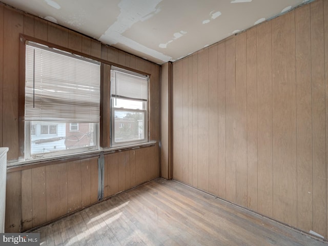 820 Tuckerman St NW, Washington, DC 20011 - unfurnished room with light wood-type flooring and wood walls