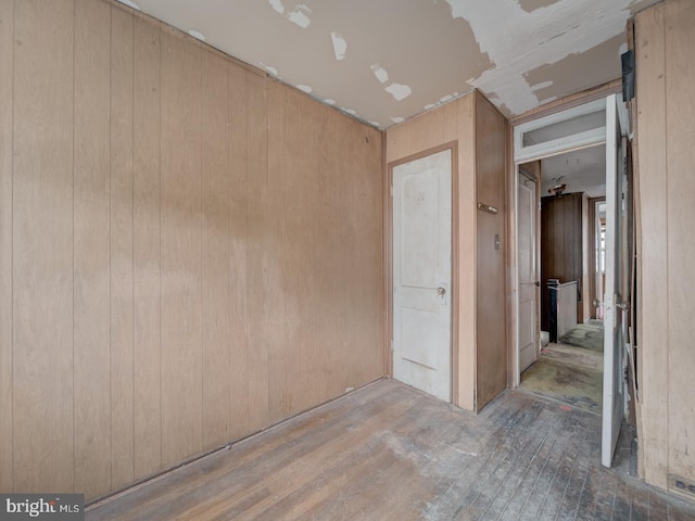 820 Tuckerman St NW, Washington, DC 20011 - spare room featuring wood-type flooring and wooden walls