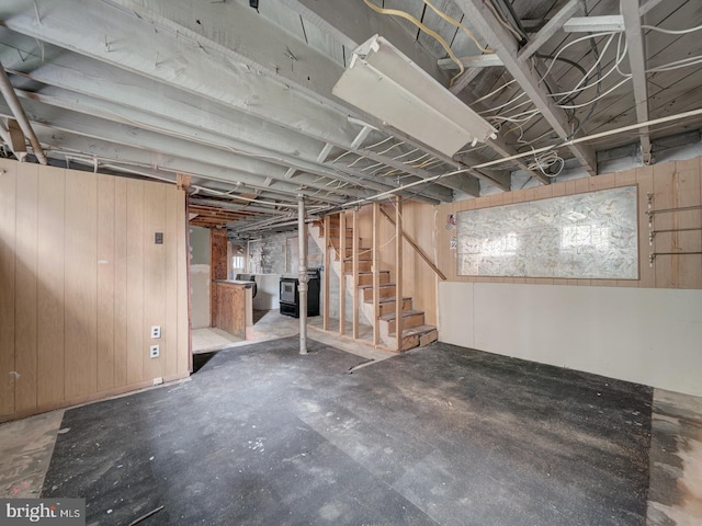 820 Tuckerman St NW, Washington, DC 20011 - unfinished below grade area featuring stairs and wooden walls