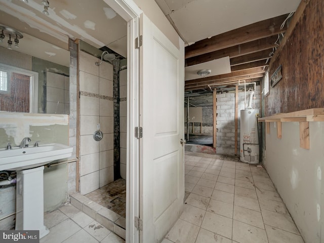 820 Tuckerman St NW, Washington, DC 20011 - bathroom with gas water heater, a tile shower, and tile patterned flooring