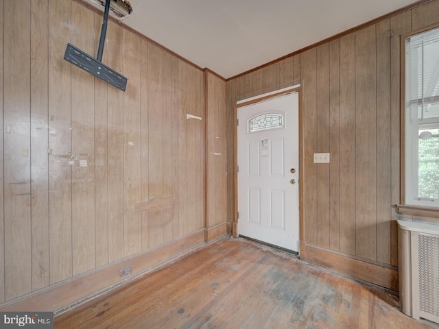 820 Tuckerman St NW, Washington, DC 20011 - entrance foyer with wooden walls, crown molding, hardwood / wood-style flooring, and radiator