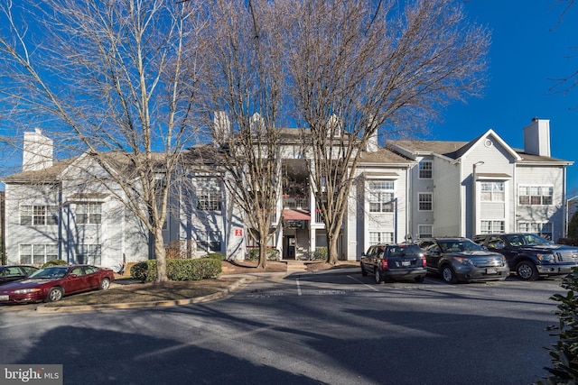 view of property with uncovered parking