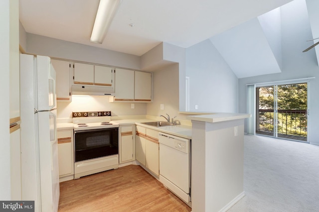 kitchen featuring white appliances, a sink, under cabinet range hood, a peninsula, and light countertops