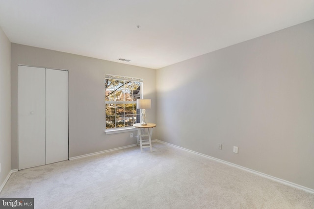 unfurnished bedroom with carpet flooring and baseboards