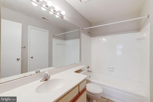 bathroom with toilet, shower / washtub combination, and vanity